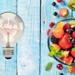 Macedonia tagliata e lampadina con scritto idea
